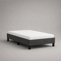 Set letto singolo 90 × 200 cm con materasso in schiuma, telaio imbottito in tessuto grigio antracite e piedi neri, senza testiera